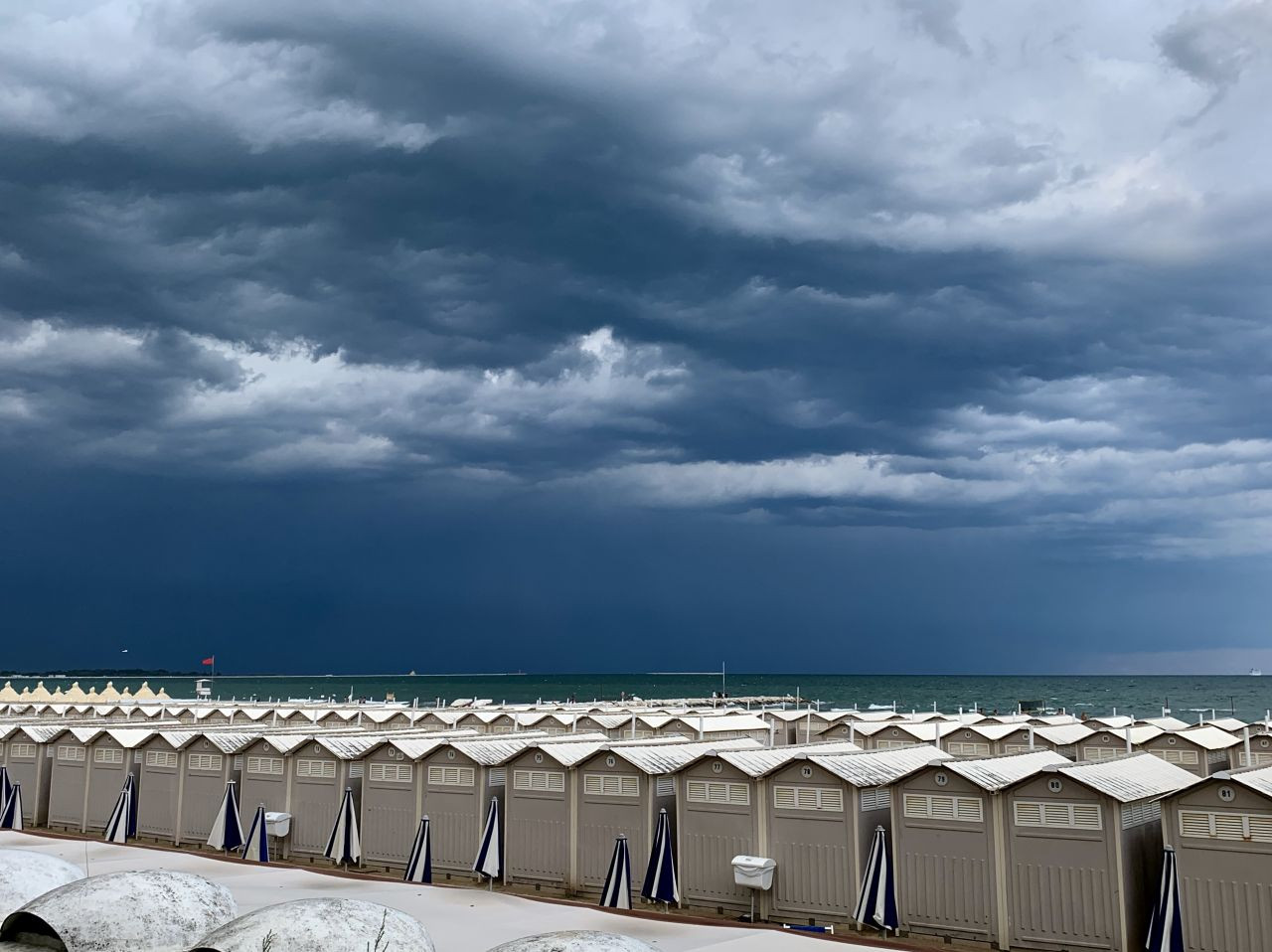 Stormy skies over the beach huts